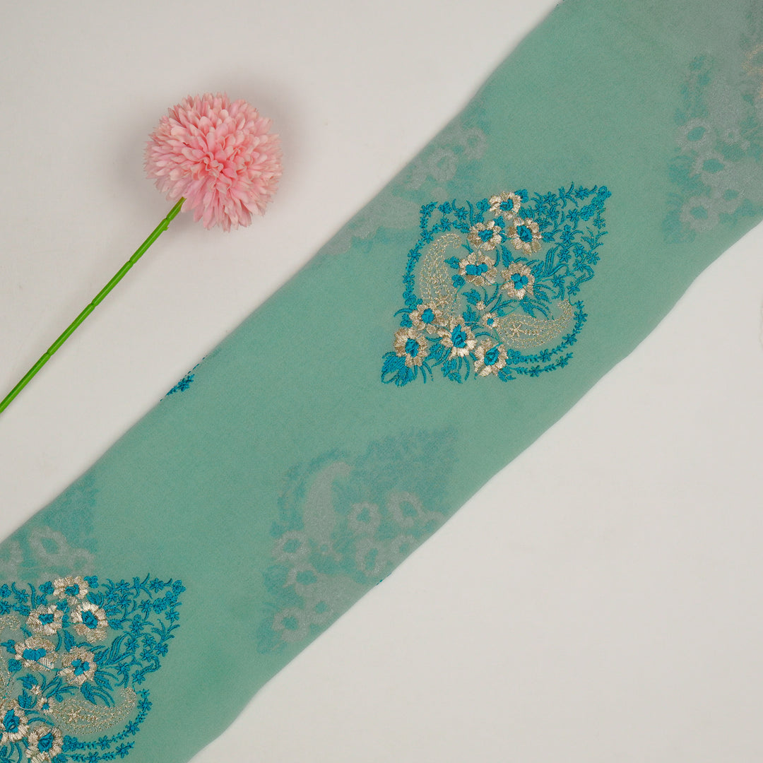 Abila Buta on Aqua Semi Georgette Embroidered Fabric
