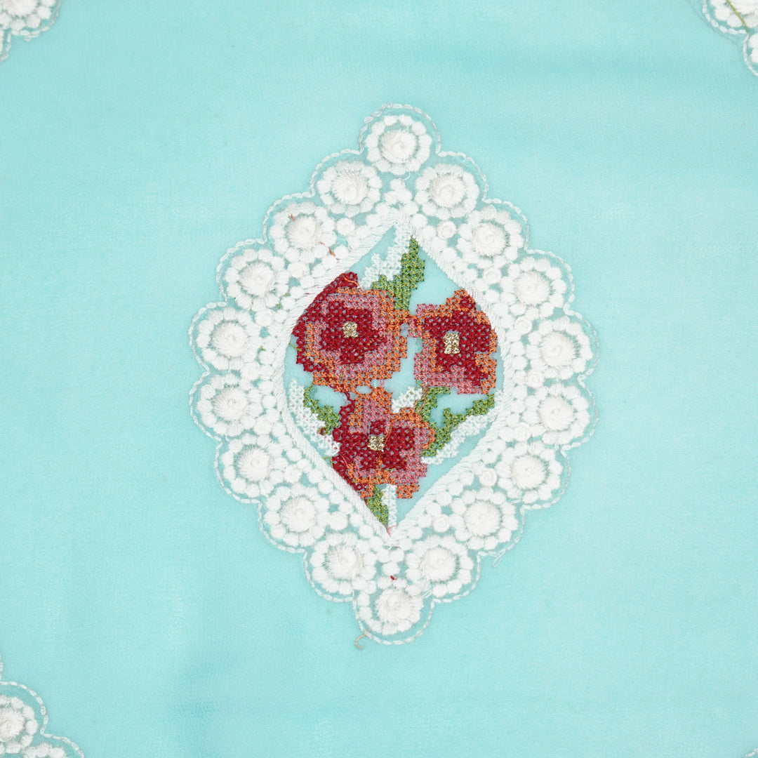 Zinal Buta on Turquoise Semi Georgette Embroidered Fabric