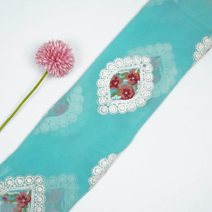 Zinal Buta on Turquoise Semi Georgette Embroidered Fabric