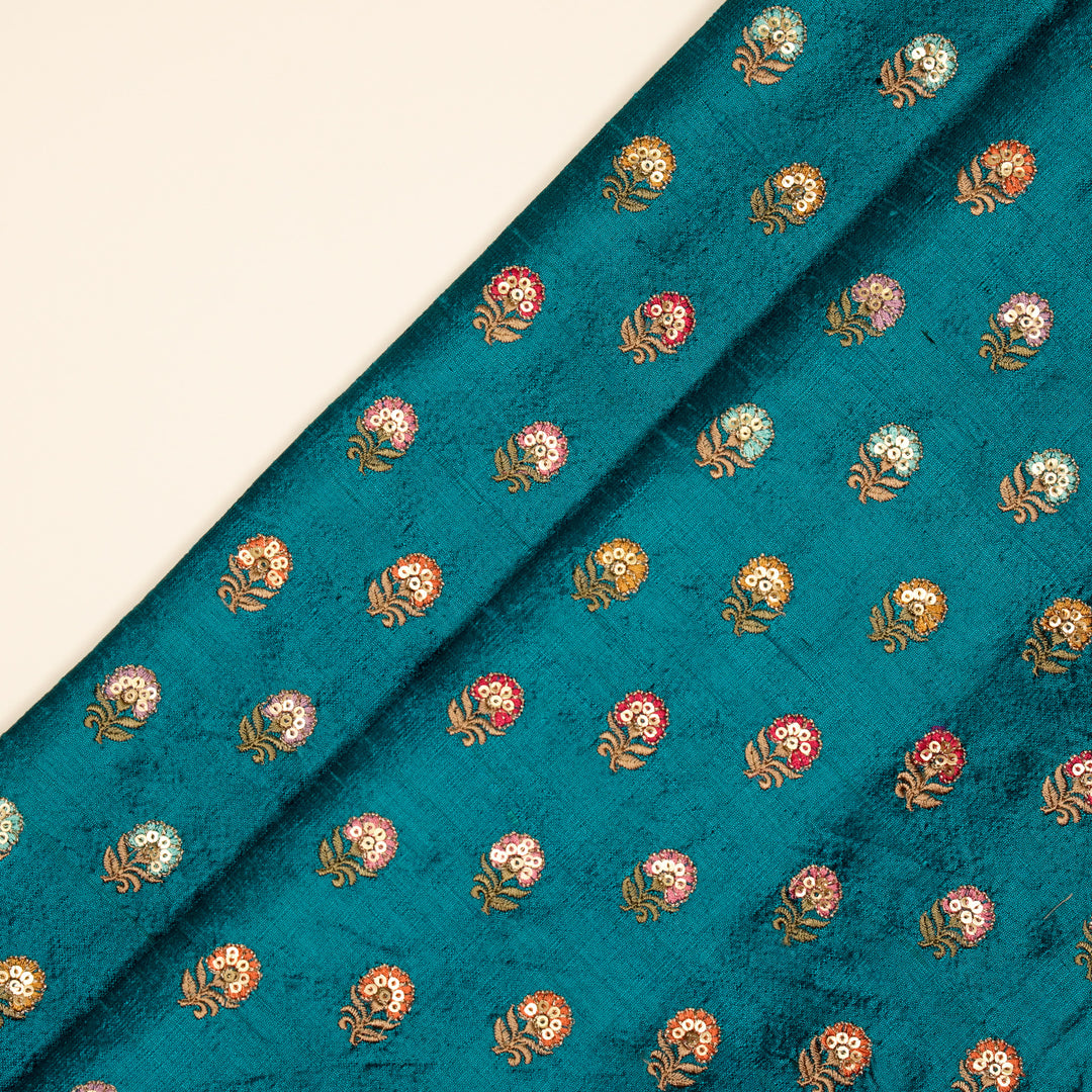 Gulfi Buti on Peacock Blue Raw Silk Embroidered Fabric