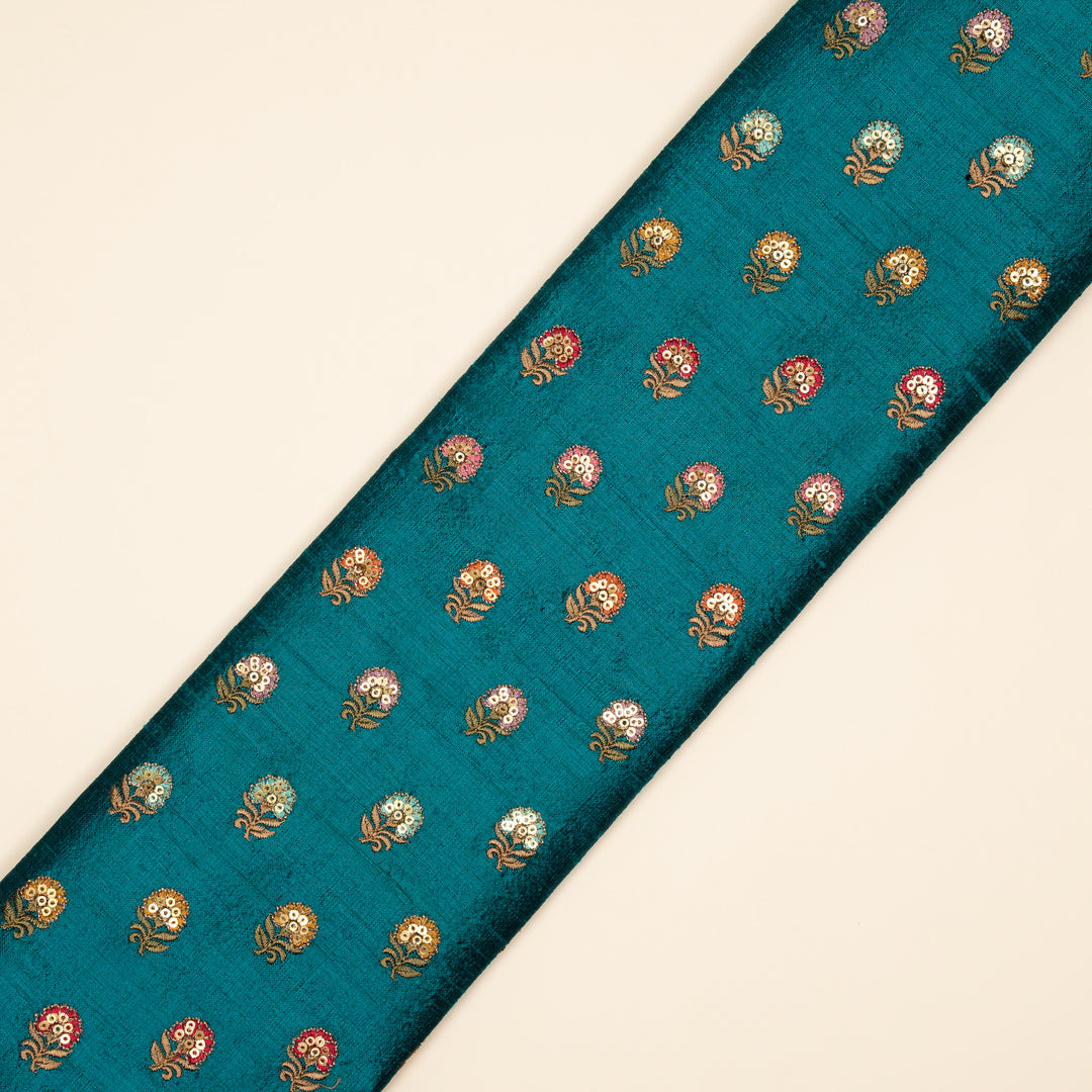 Gulfi Buti on Peacock Blue Raw Silk Embroidered Fabric