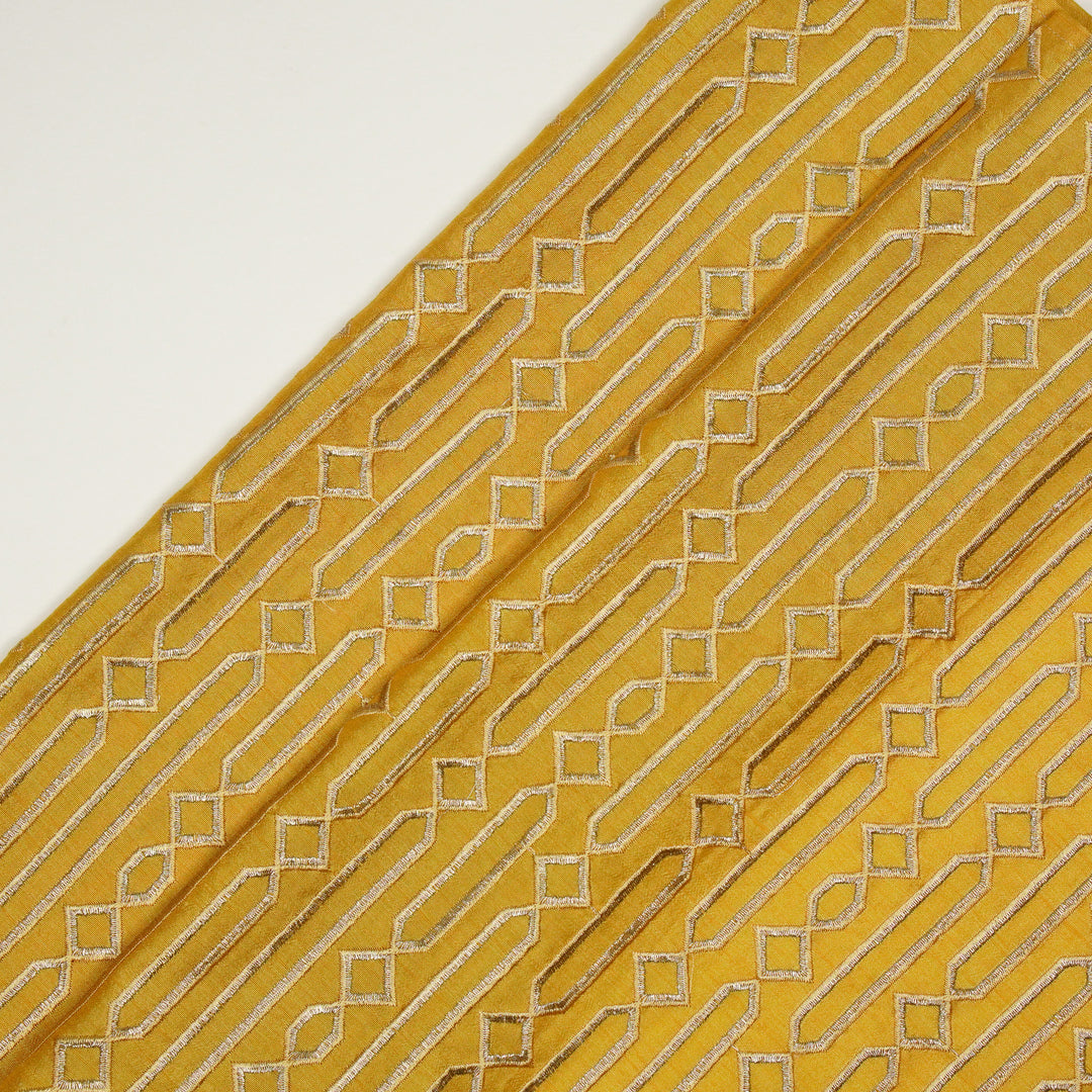 Tanira Jaal on Gold Semi Raw Silk Embroidered Fabric