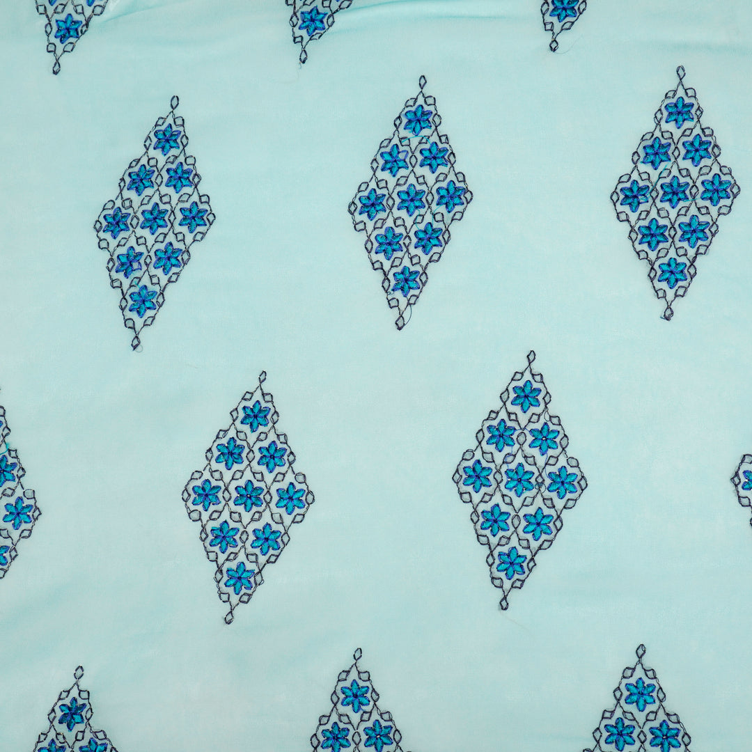 Aseela Buta on Aqua Semi Georgette Embroidered Fabric