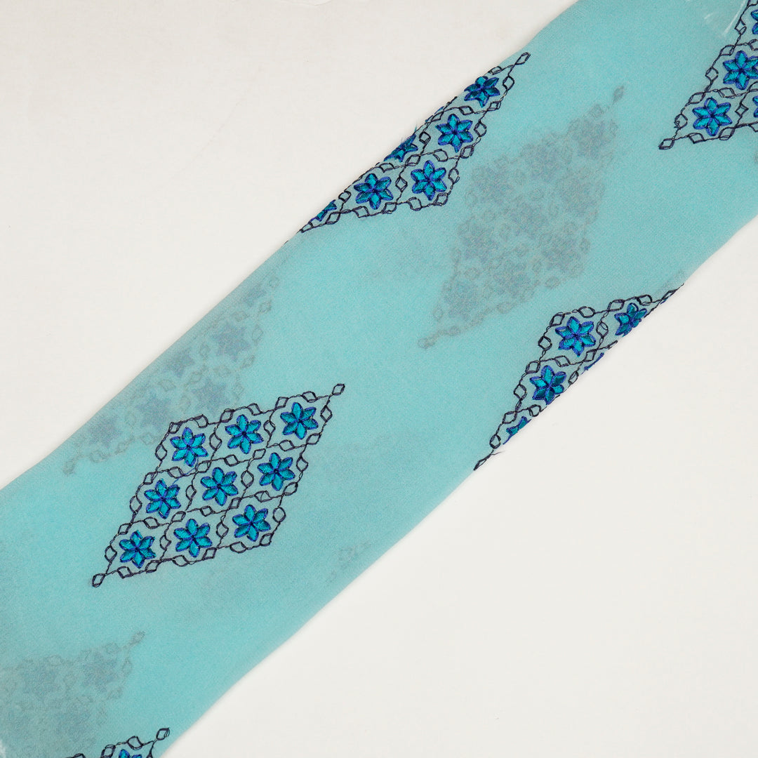 Aseela Buta on Aqua Semi Georgette Embroidered Fabric