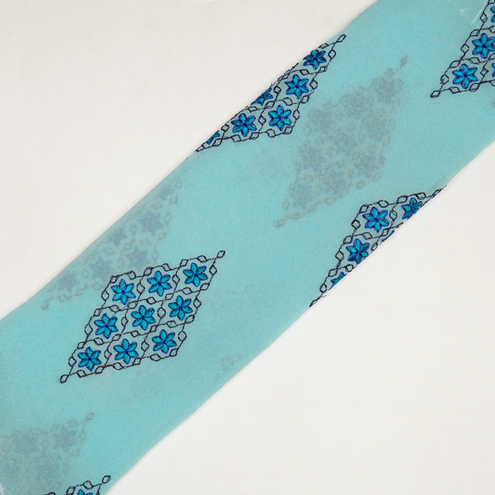 Aseela Buta on Aqua Semi Georgette Embroidered Fabric