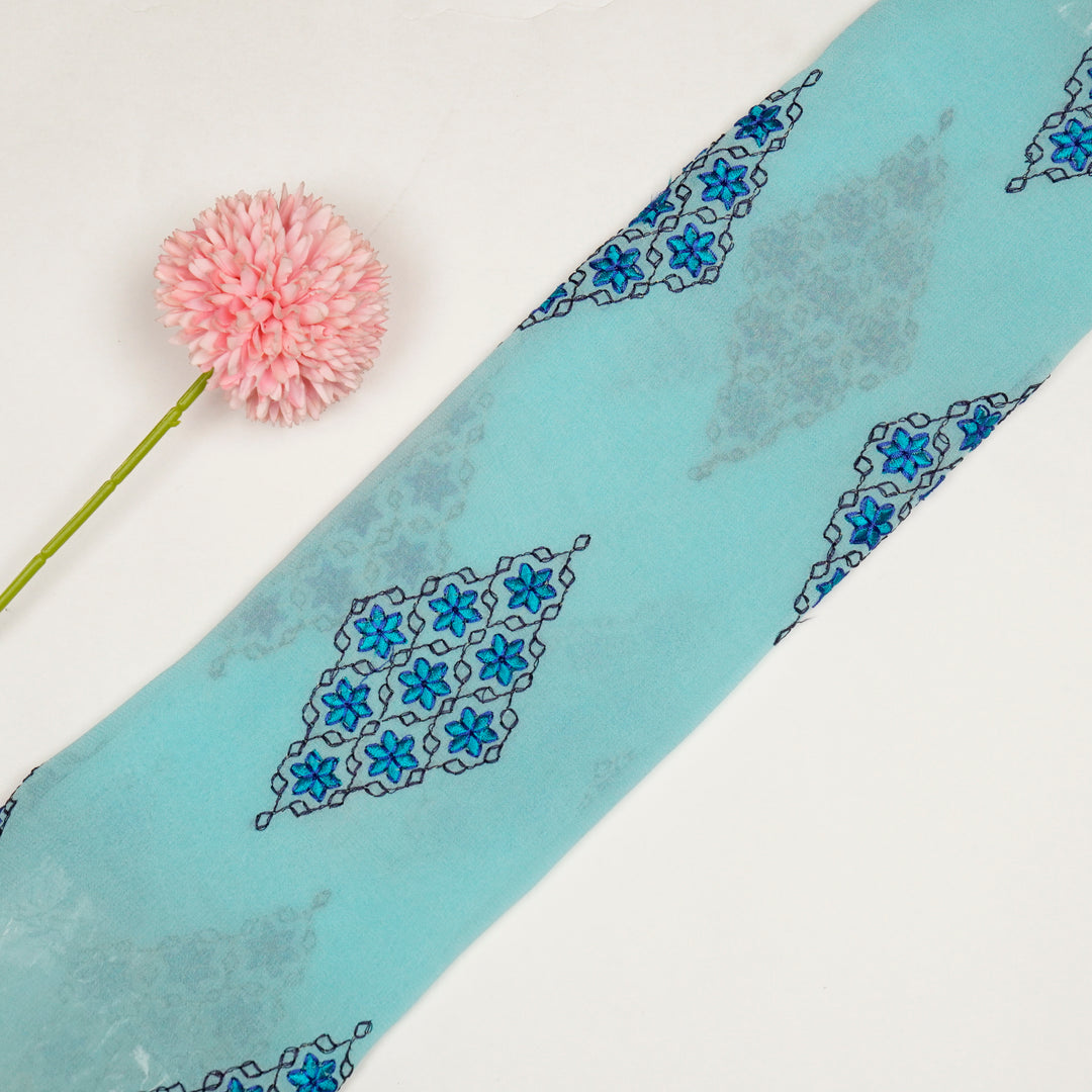 Aseela Buta on Aqua Semi Georgette Embroidered Fabric
