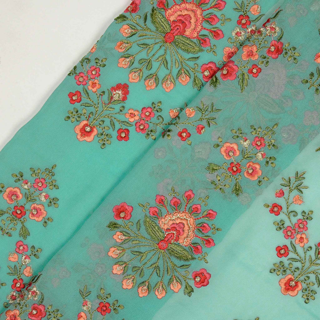 Nutan Jaal on Turquoise Georgette Embroidered Fabric